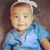 Smiling baby in blue shirt