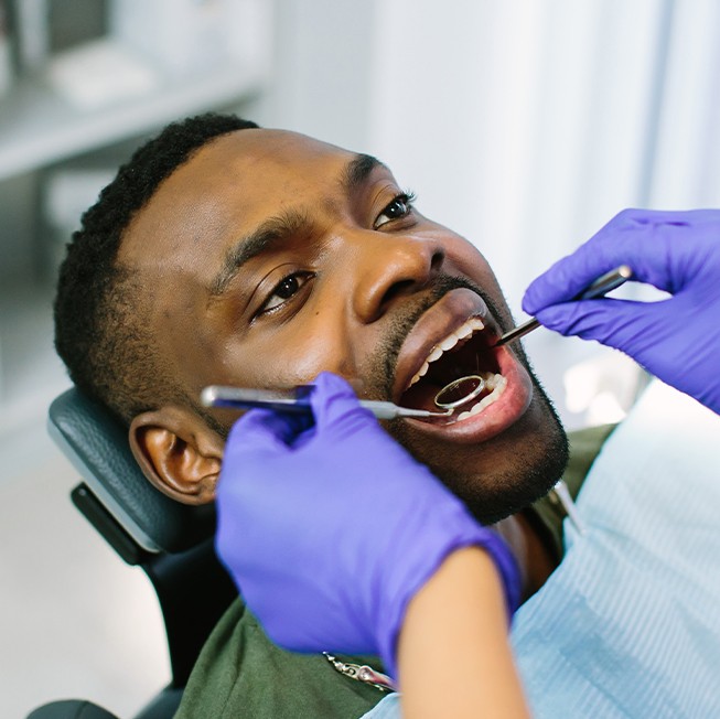 Dentist checking dental sealants