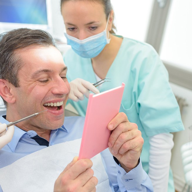 man smiling after getting dental bridge in Corpus Christi 