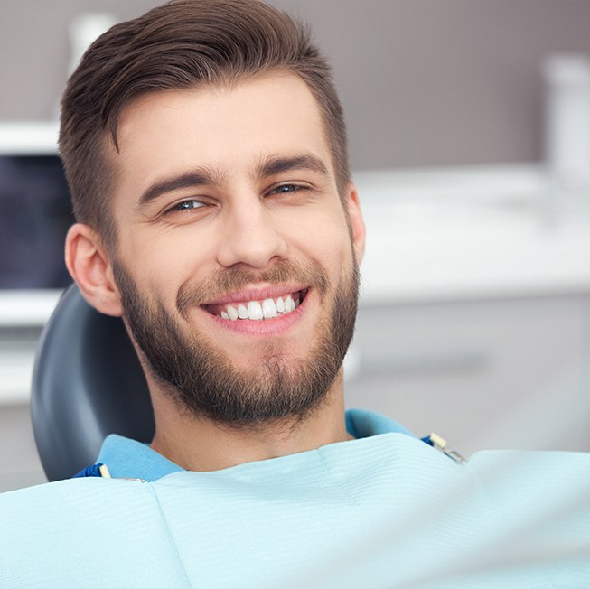 Man smiling after comprehensive dental checkup