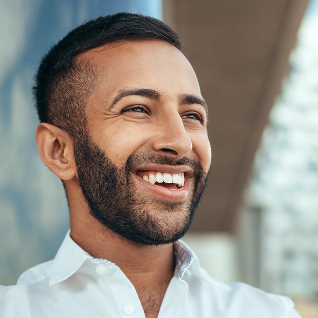 Man sharing flawless smile after cosmetic dentistry