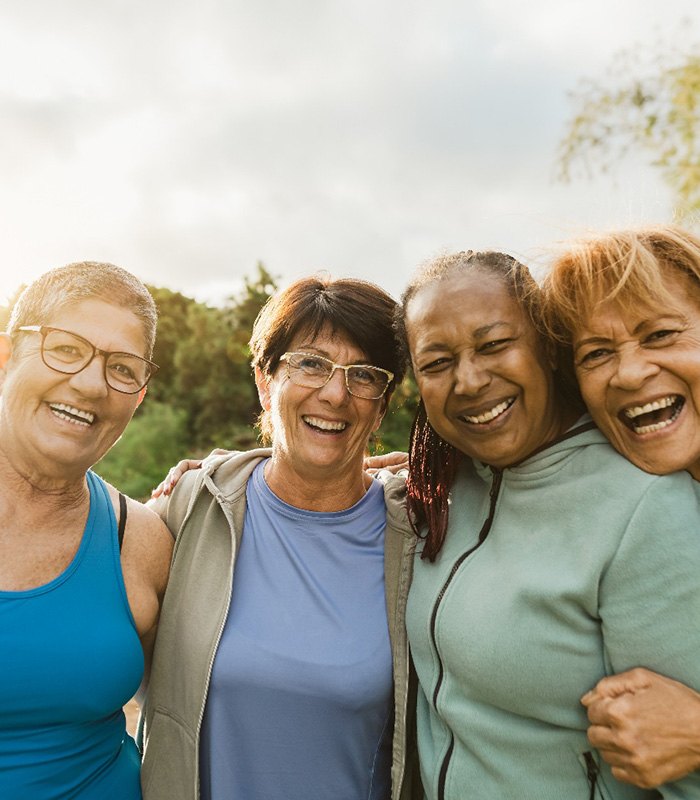 Group of happy, mature friends spending time outdoors