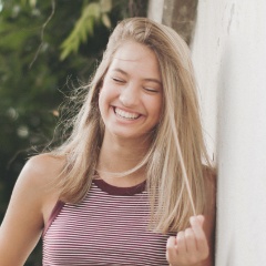 Young woman with aligned smile after Invisalign treatment