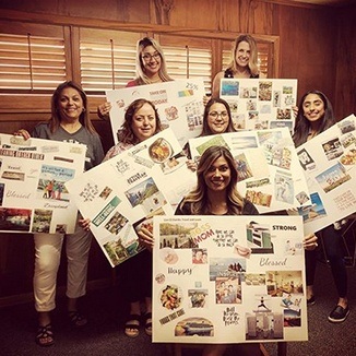 Dental team members holding up posterboards