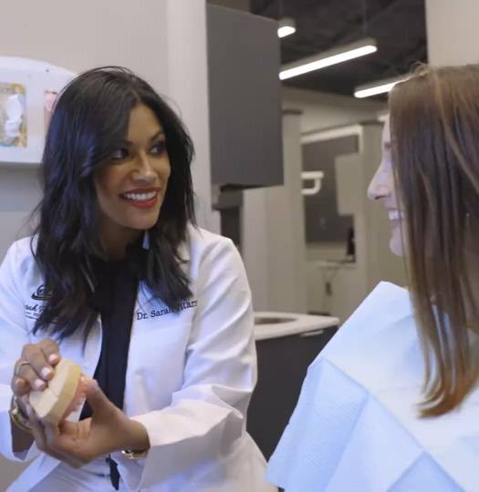 team member talking with patients