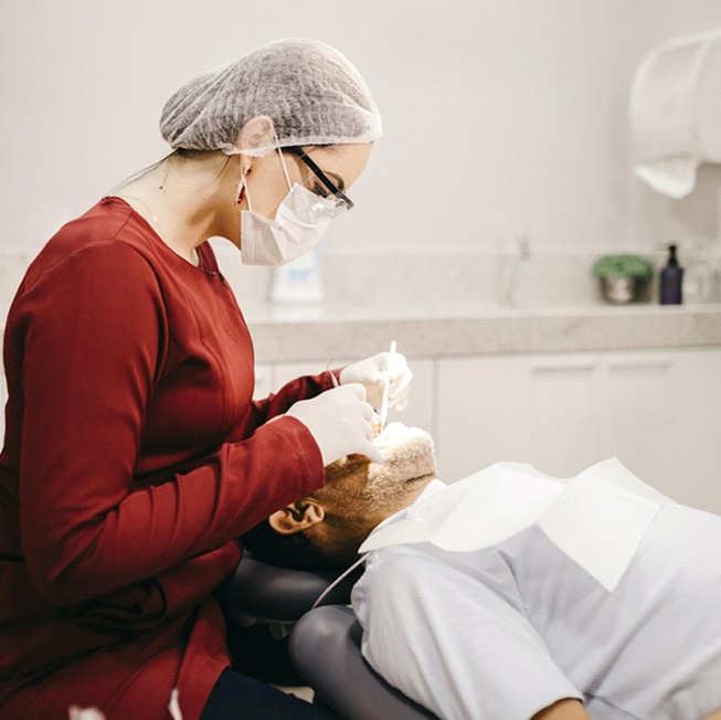 Dentist placing tooth-colored filling
