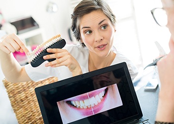 A dentist shows a patient their future smile with veneers in Corpus Christi