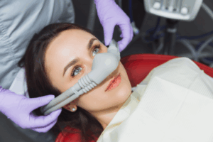 a patient smiling before receiving sedation dentistry